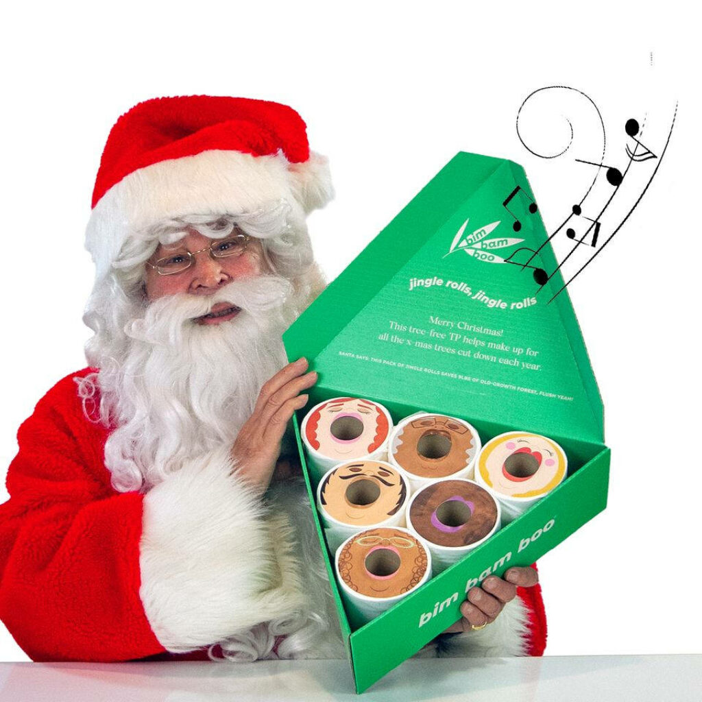 Festive Santa Claus with Gift Box and Whimsical Music Notes Wallpaper