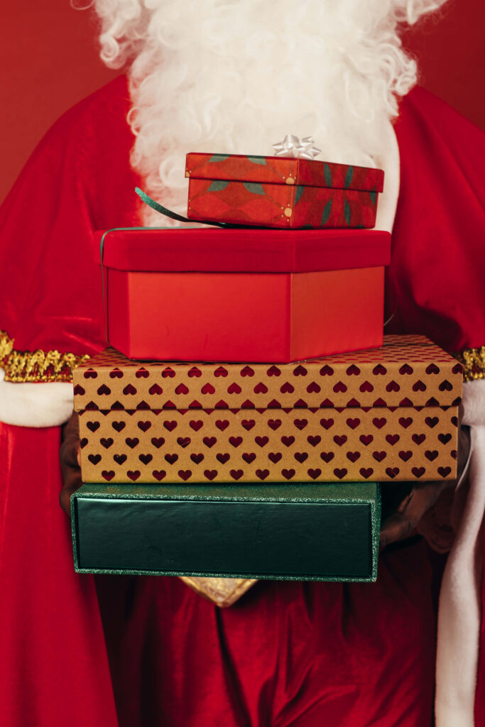 Festive Santa Wallpaper: Cheerful Christmas Spirit on Red Background