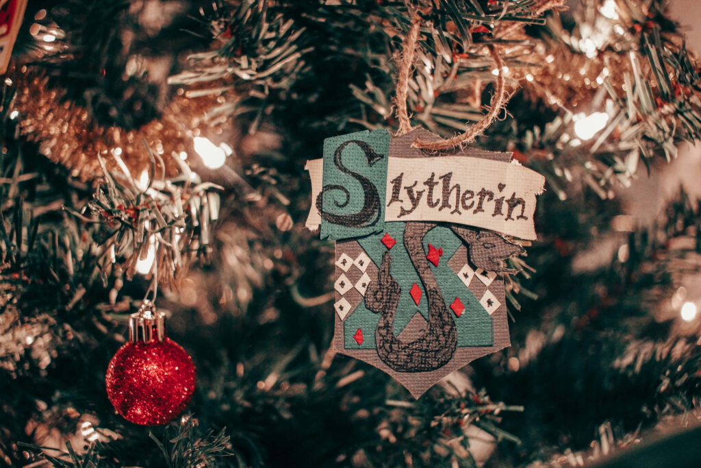 Magical Slytherin Christmas Tree Wallpaper with Sparkling Lights