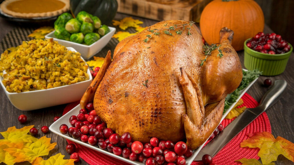 Festive Thanksgiving Wallpaper: Roasted Turkey with Cranberries & Sides