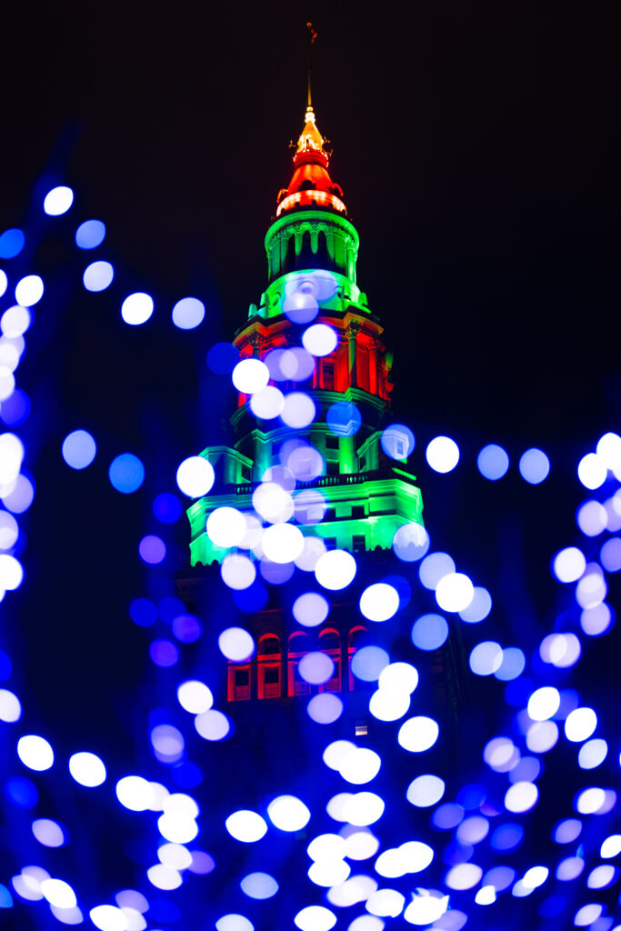Festive Tower Wallpaper: Illuminated with Holiday Colors & Lights