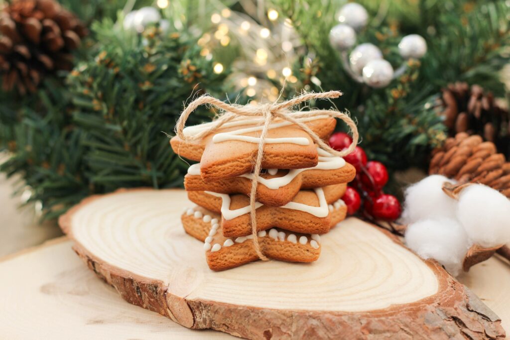 Festive Wallpaper: Stacked Decorated Cookies with Holiday Greens & Lights