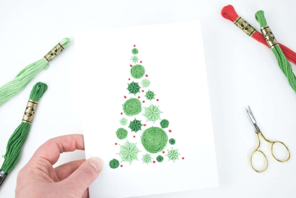 Festive Christmas Card Wallpaper with Embroidered Tree Design