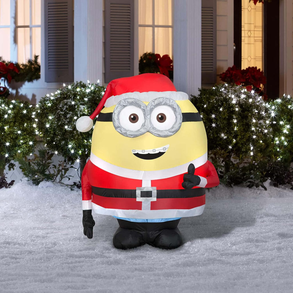 Festive Minion Santa Wallpaper: Cozy Snowy Lights Background