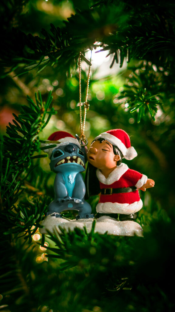 Festive Holiday Wallpaper: Santa Hat Figurine & Cheerful Scene