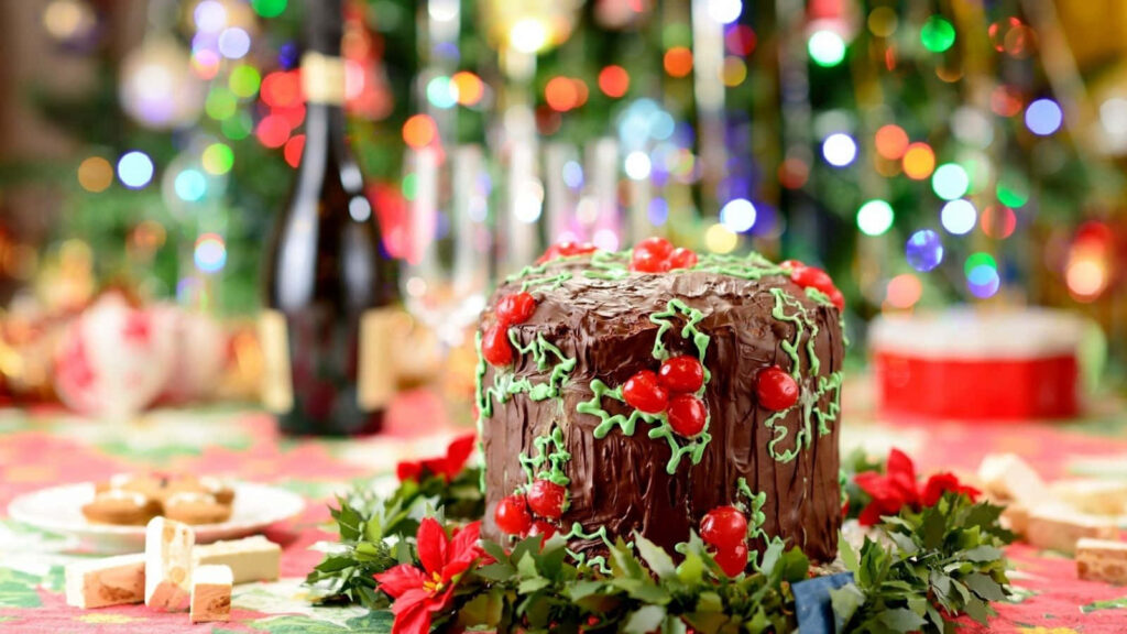 Festive Winter Food Spread: Chocolate Cake with Holiday Decor Wallpaper