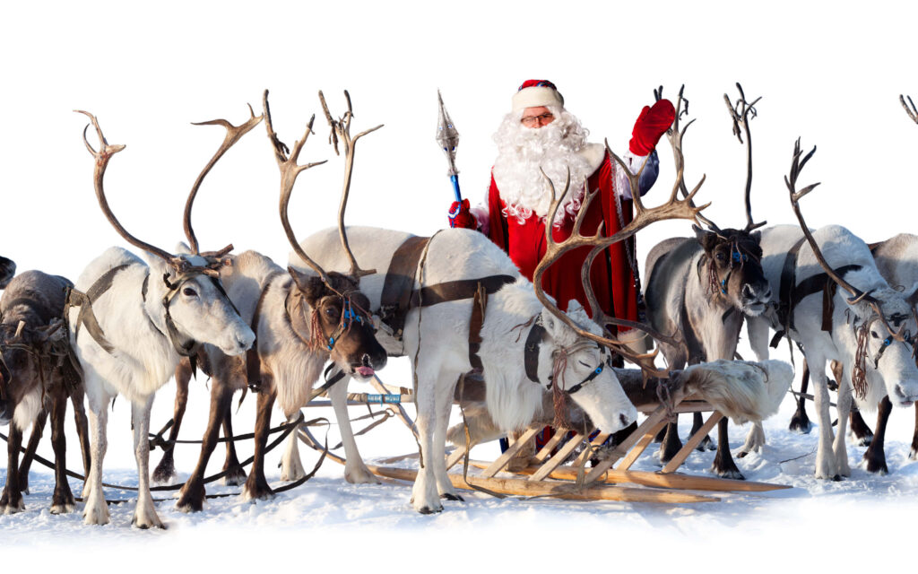 Festive Winter Scene: Santa, Reindeer, and Snowy Landscape Wallpaper