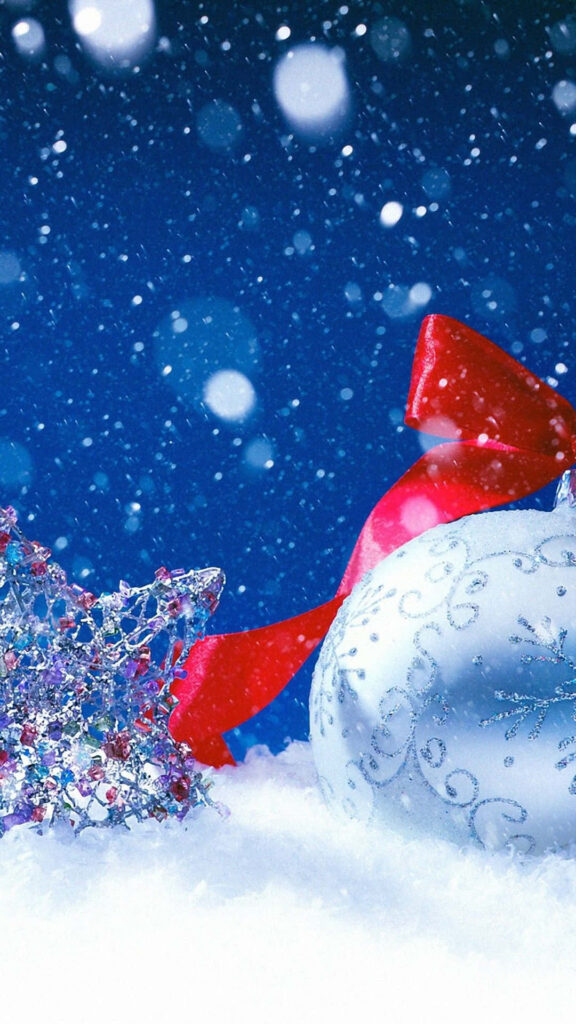 Festive Winter Wallpaper: Silver Ornament & Red Ribbon on Snowy Background
