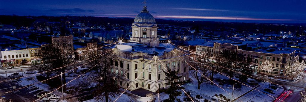 Twilight Monroe County Courthouse Bloomington Indiana with holiday lights and snow winter scene Wallpaper