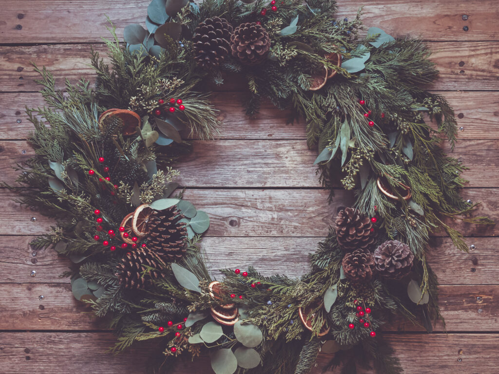 Festive Pine Wreath Wallpaper: Rustic Holiday Decor Background