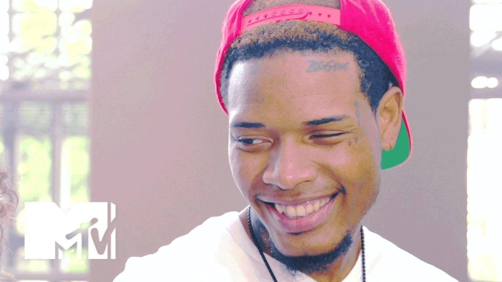 Portrait of rapper Fetty Wap smiling wearing red backwards cap with tattoos MTV interview close-up Wallpaper