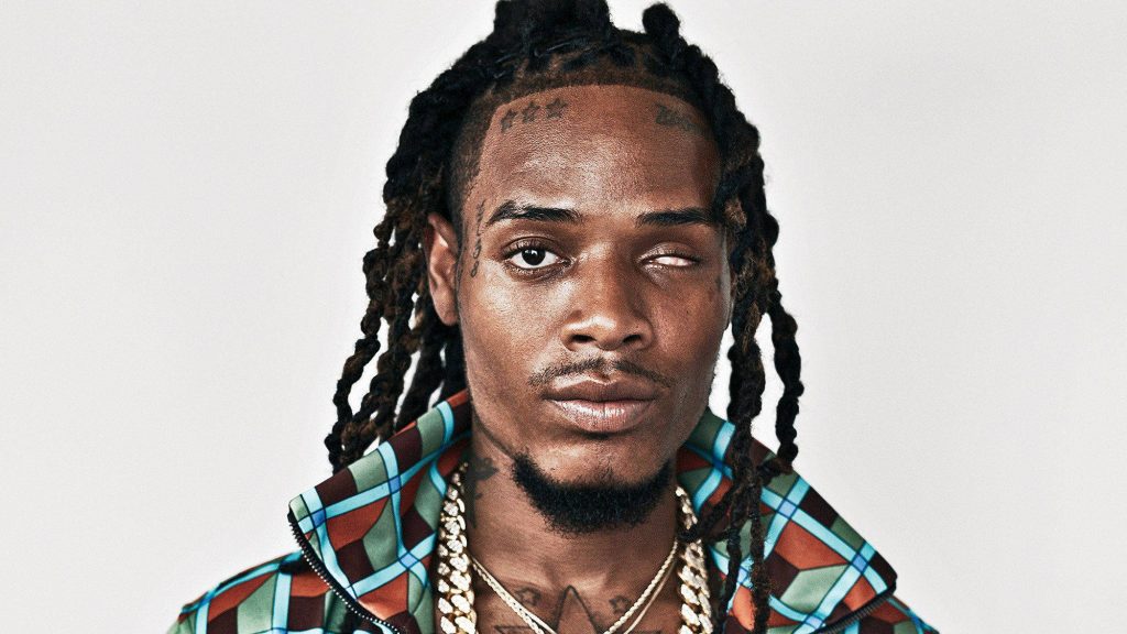 High-resolution portrait of Fetty Wap with dreadlocks facial tattoos colorful jacket gold chains Wallpaper