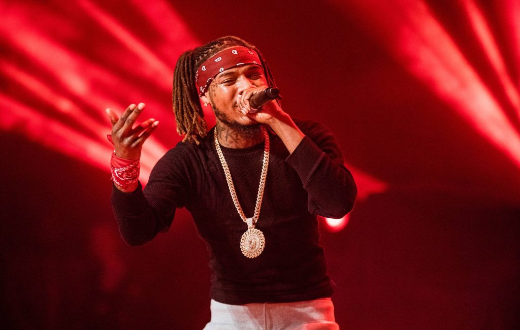Fetty Wap live concert wallpaper with red bandana gold chain and vibrant red stage lighting