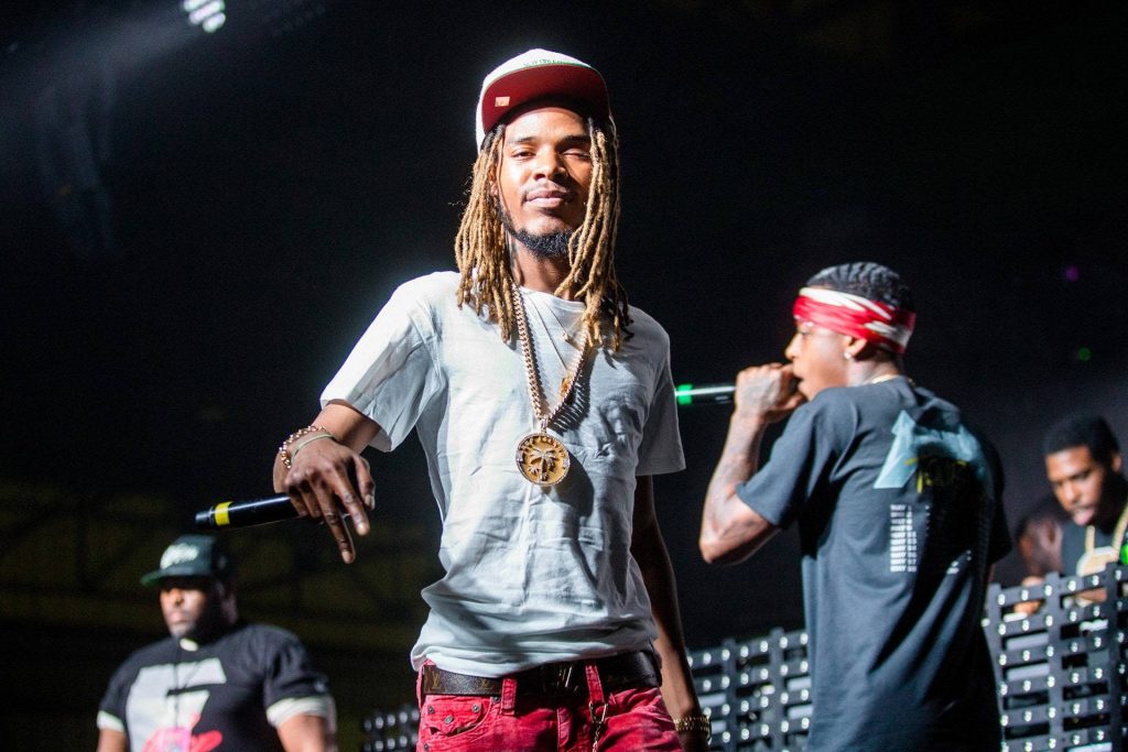 Fetty Wap live concert wallpaper rapper on stage with dreadlocks white tee red jeans gold medallion