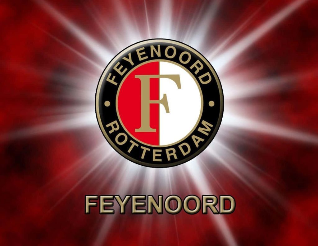 Feyenoord Rotterdam crest on radiant red background bold football fan wallpaper design