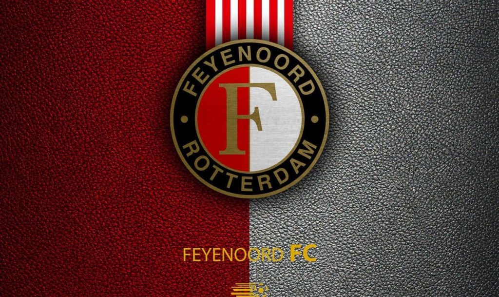 Feyenoord Rotterdam wallpaper with official crest on textured red and black leather background
