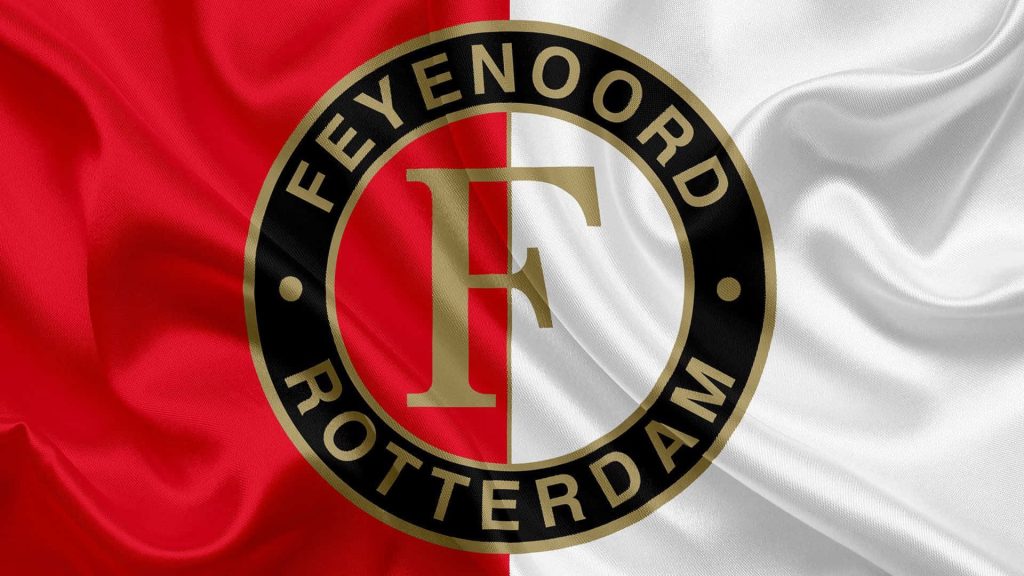 Feyenoord Rotterdam logo on wavy red and white fabric wallpaper showcasing football passion