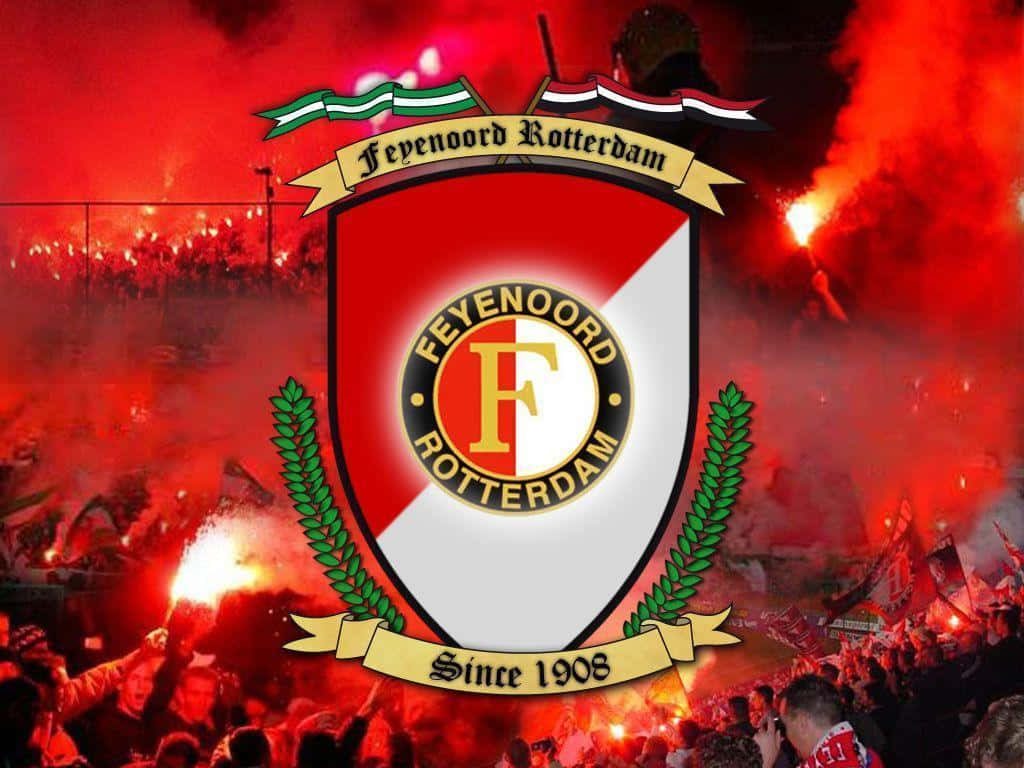 Feyenoord Rotterdam wallpaper with club crest and vibrant red flare smoke in packed stadium