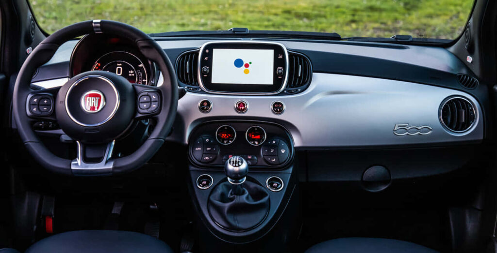 Stylish Fiat 500 Interior: Modern Dashboard & Vibrant Wallpaper Background