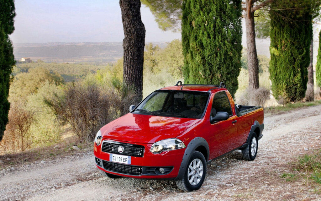 Fiat Strada Trekking Wallpaper: Vibrant Red Pickup in Serene Countryside