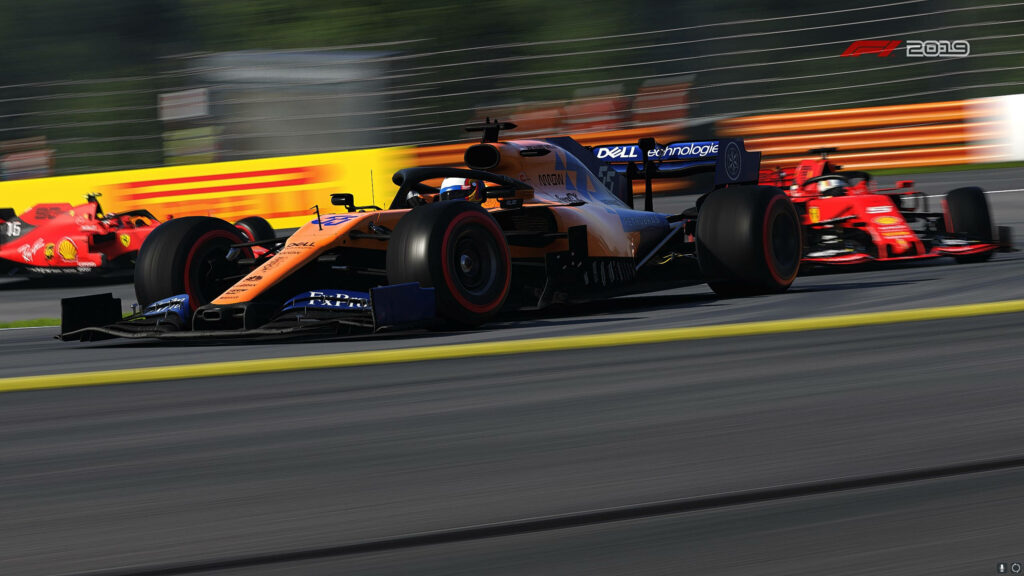Intense Racing Action Captured: F1 2019 Mid-Race Madness in Striking Background Shot Wallpaper