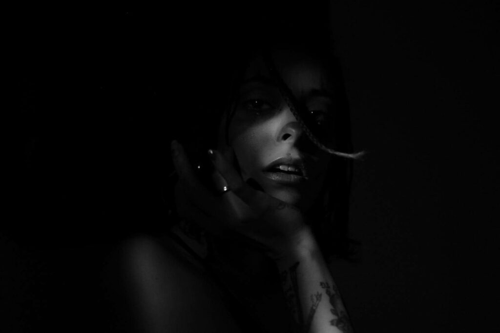 Mysterious Seductress: Captivating Beauty in a Noir-inspired Photoshoot Wallpaper