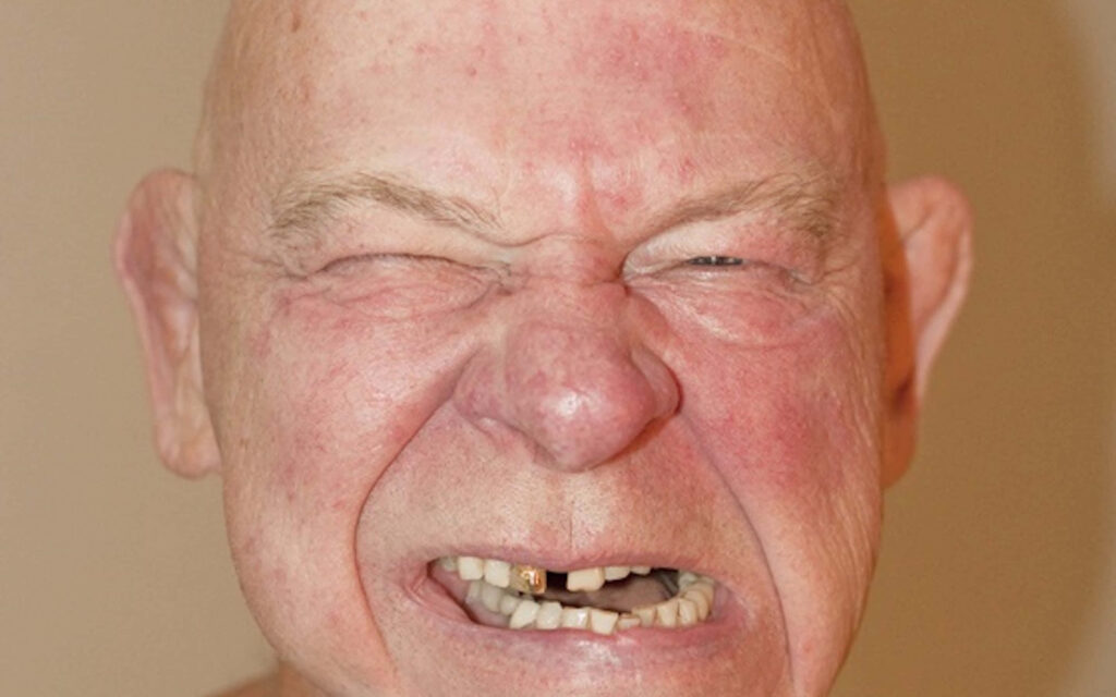 Close up of American wrestler Baron Von Raschke with intense fierce expression wallpaper background