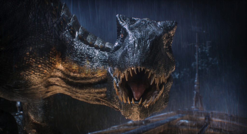 Fierce Dinosaur Roaring in Rain | Intense Jurassic World Wallpaper