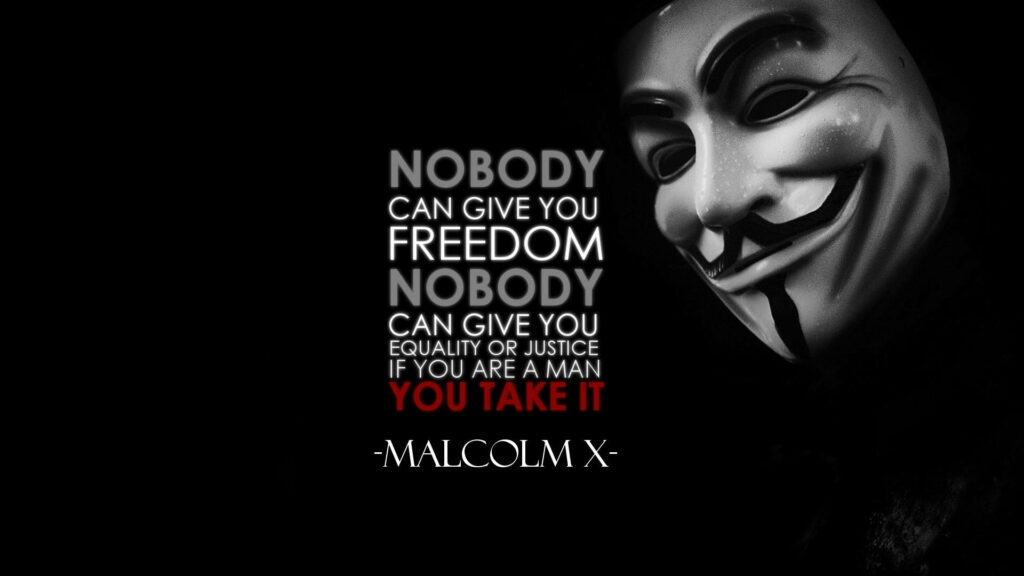 Guy Fawkes mask with Malcolm X freedom quote bold text dark background activism wallpaper