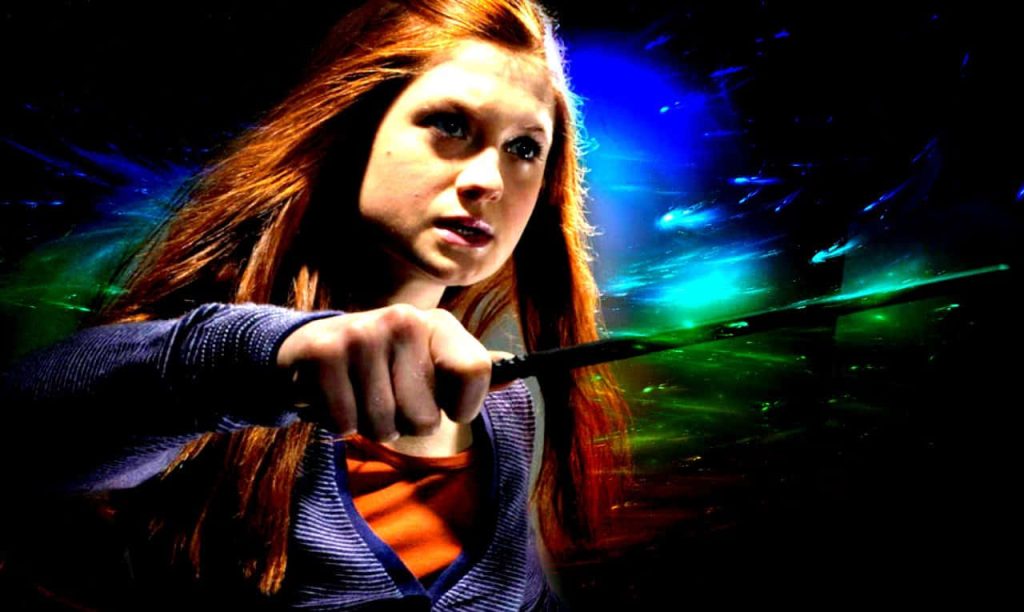 Ginny Weasley casting a vibrant blue green spell with wand intense magical wallpaper background
