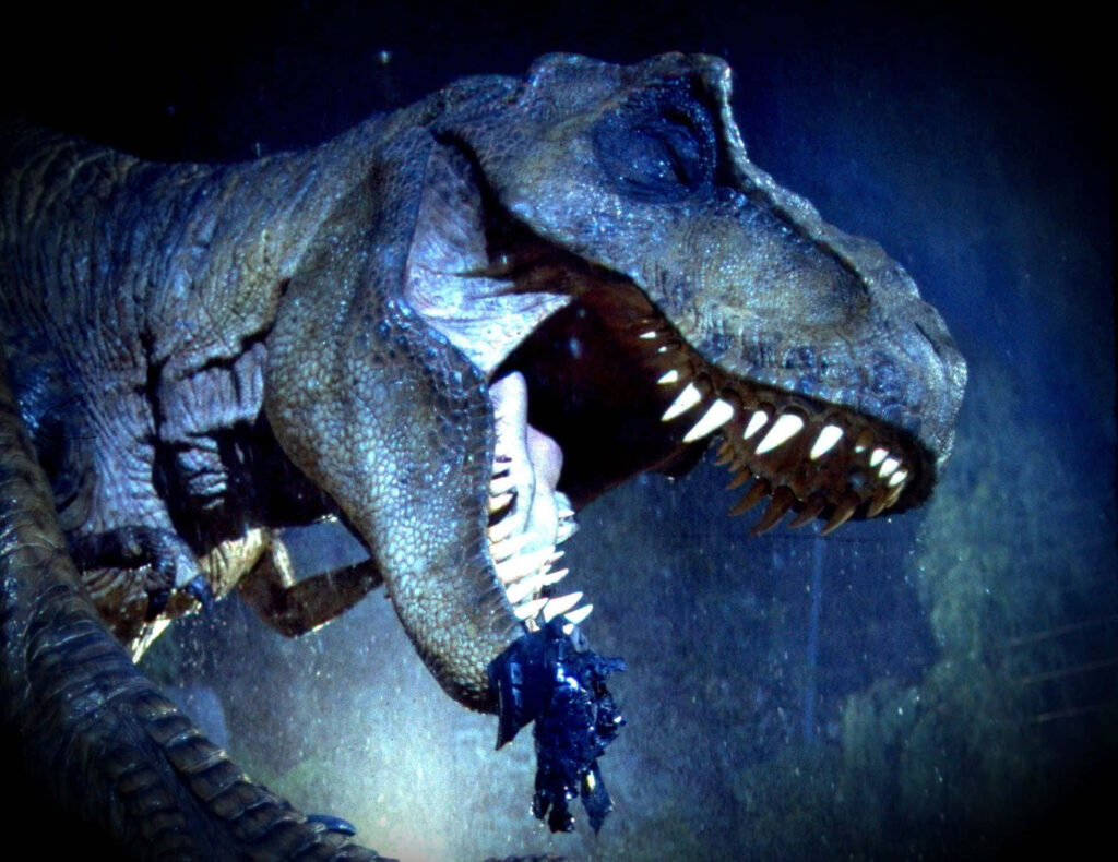 Fierce T-Rex in Dramatic Blue Light | Jurassic World Wallpaper