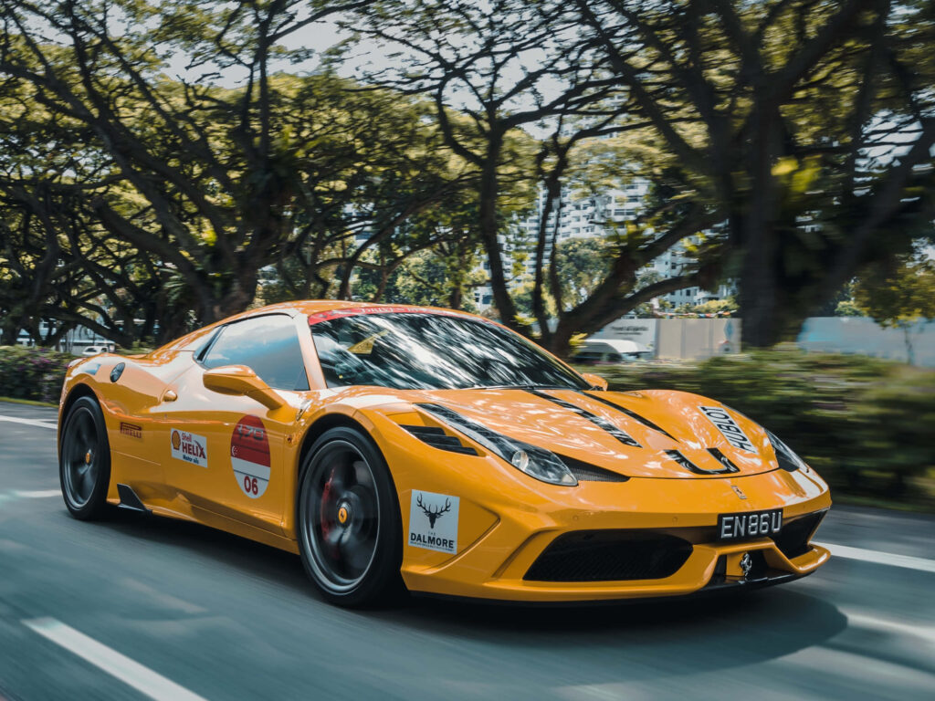 Orange Custom Ferrari Sports Car on a Road Background Wallpaper
