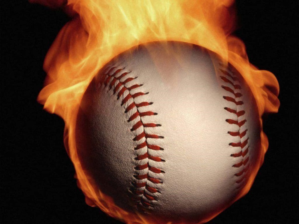 Baseball engulfed in roaring flames on black background dynamic sports wallpaper design