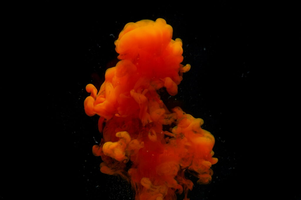 Fiery Burst: A Cool HD Wallpaper of Explosive Black and Orange Smoke