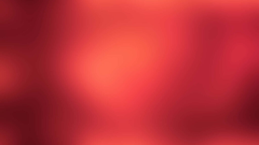 Radiant Rouge wallpaper with smooth fiery red gradient and bright luminous center background