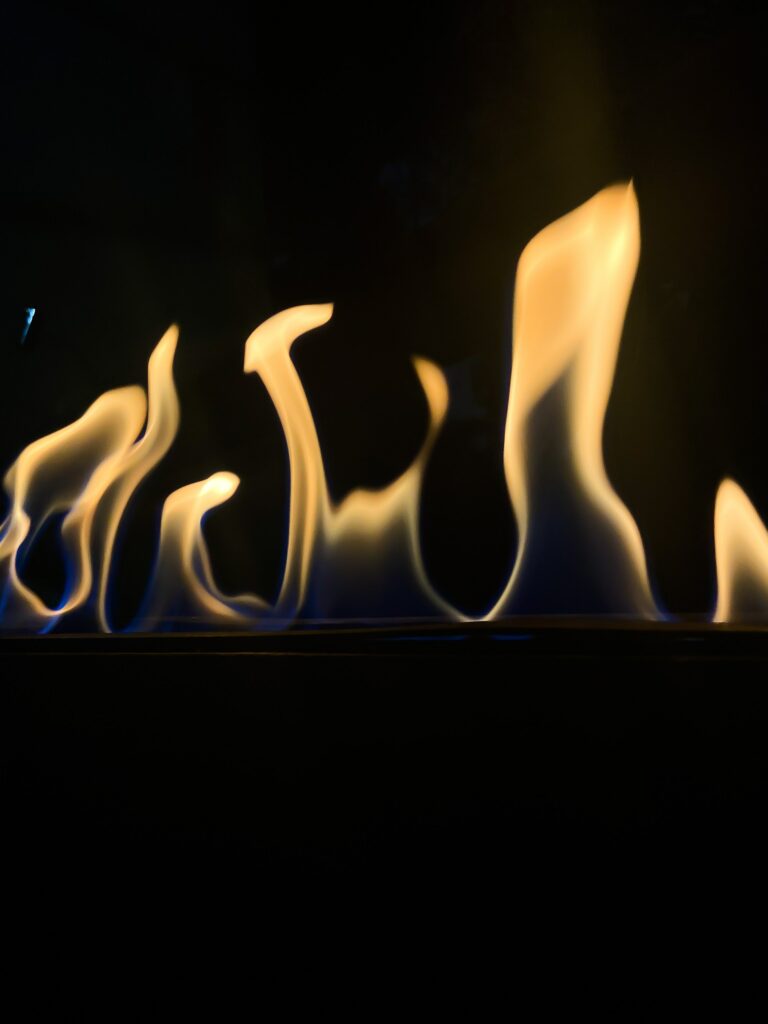 Dramatic Flames on Black: Captivating Fire Wallpaper Background