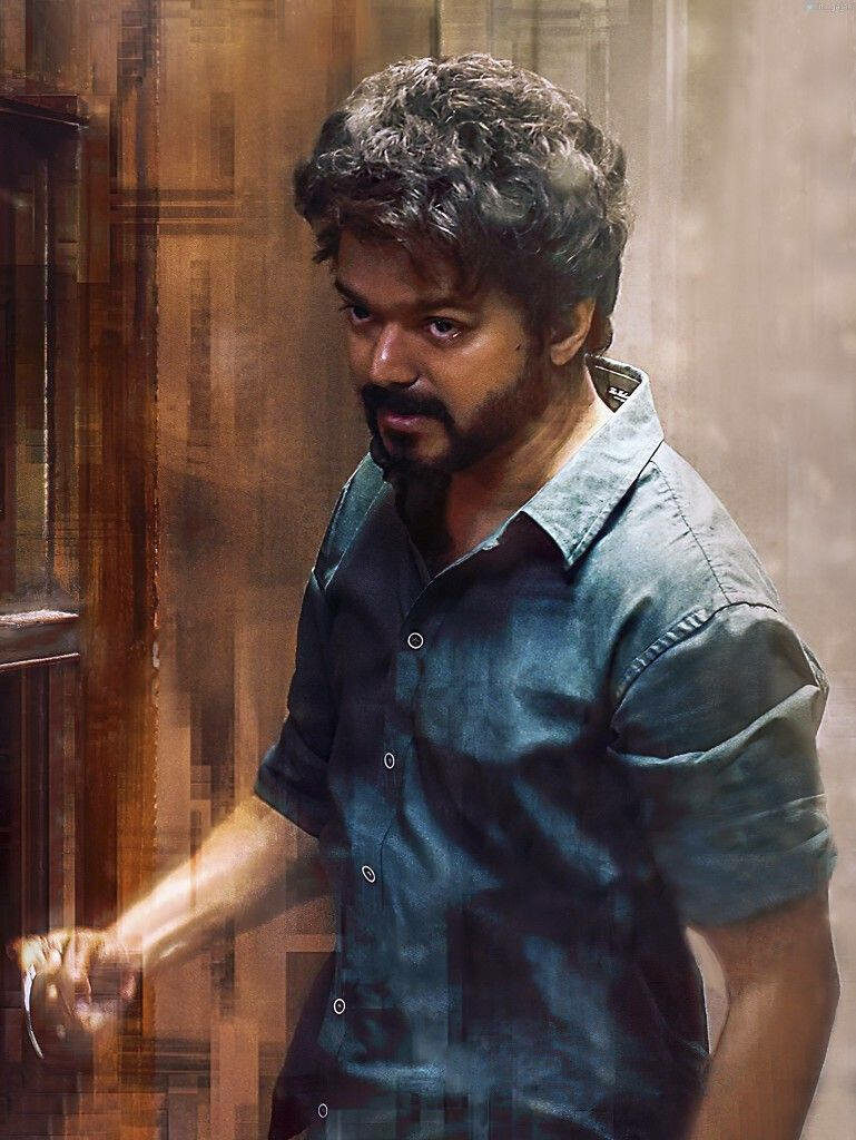 Intense Portrait: Master Vijay in a fiery backdrop Wallpaper