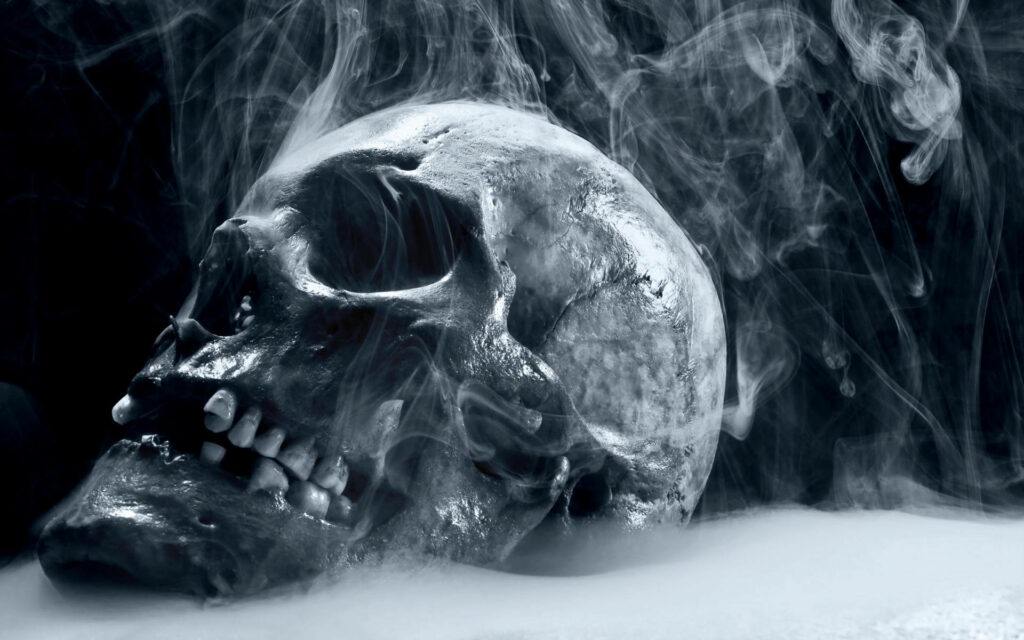 Inferno's Grin: A Dark Wallpaper Showcasing a Fiery Hd Skull Against a Mysterious Background