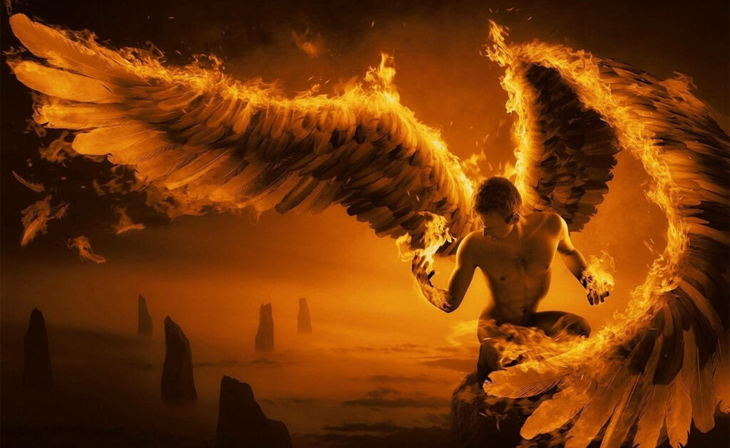 Burning Seraph atop Cloud-Kissed Boulders: Enigmatic Dark Angel with Fiery Black Wings Wallpaper