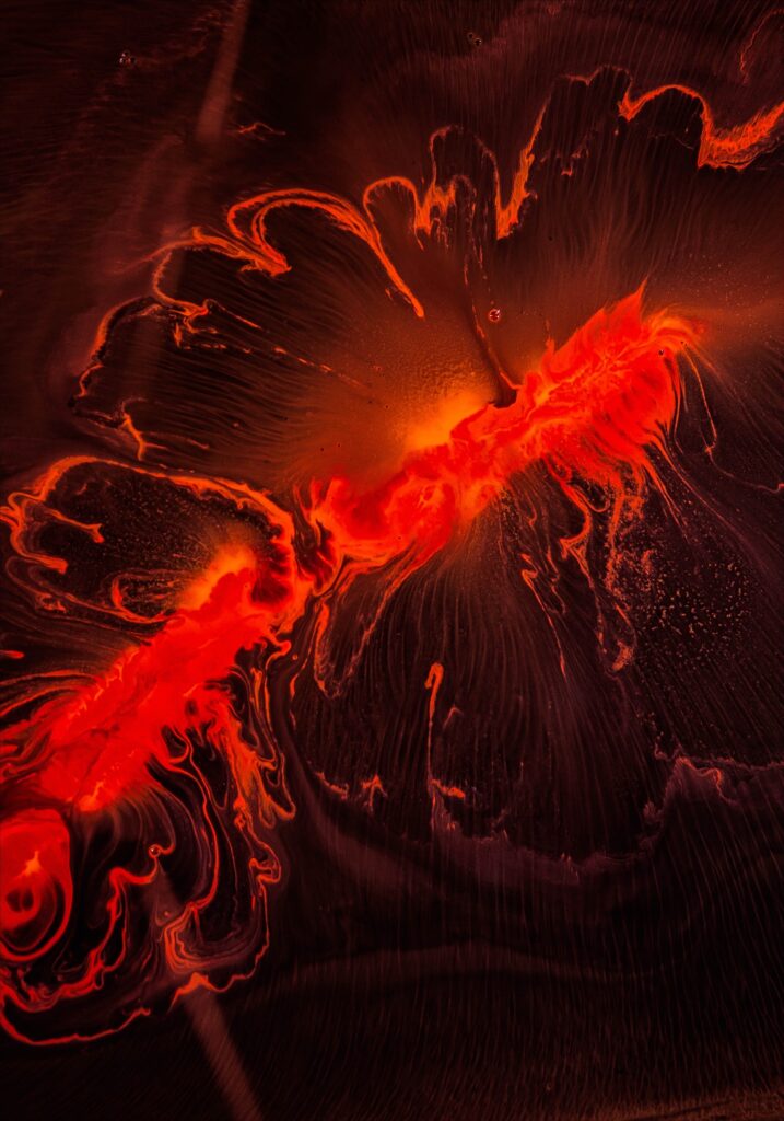 Captivating Abstract Wallpaper: Bold Red Liquid Stains on Dark Background