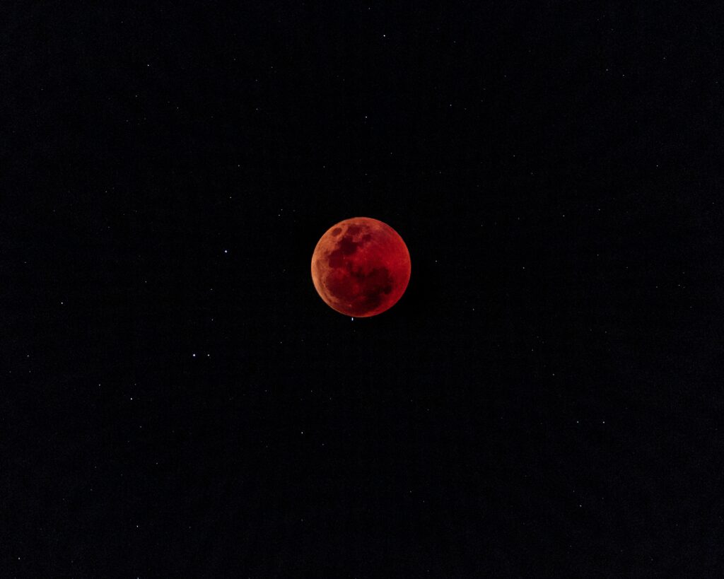 Fiery Red Moon Wallpaper: Captivating Lunar Eclipse Background