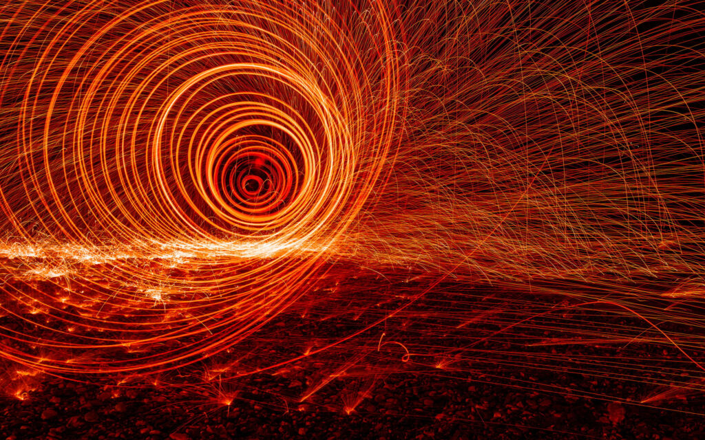 Fiery Spiral Wallpaper: Dynamic Red & Orange Light Patterns