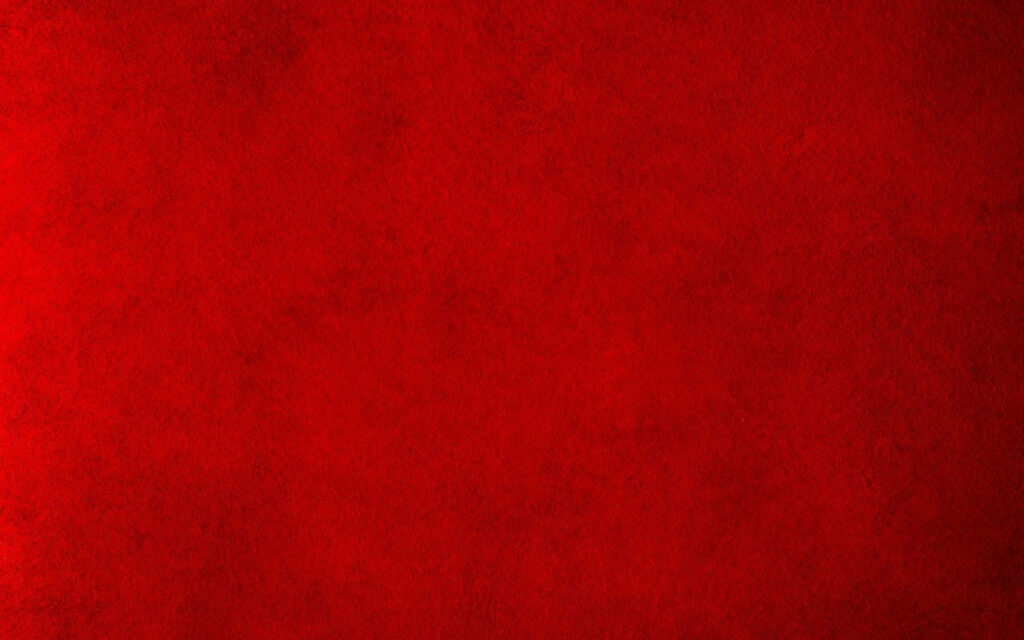 Fiery red minimalist wallpaper with deep rugged grainy texture for bold desktop background
