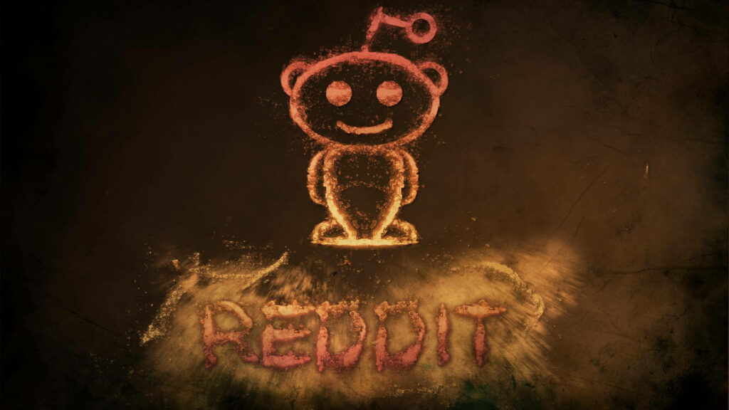 Snoo-ting Flames: A Warming Reddit Wallpaper with Blazing Ember Alien Logo