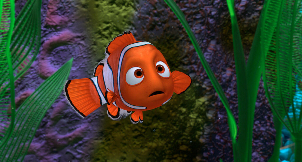 Lost in the Seagrass: A Stunning Background Snapshot Featuring Nemo from the Beloved Animated Film 'Finding Nemo' Wallpaper