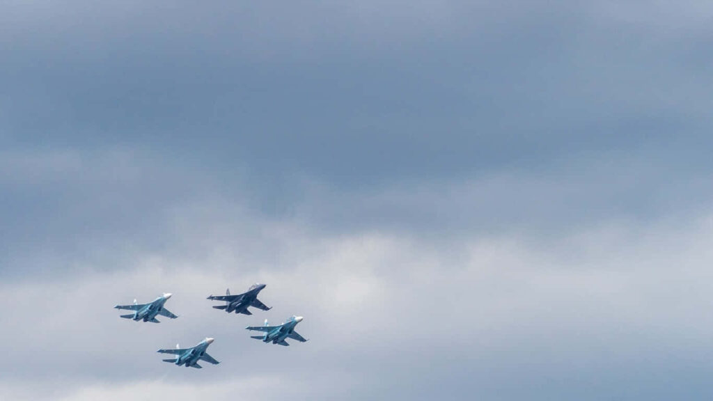 Fierce Finger Formation: Jumbo Jets and Fighter Aircrafts Paint the Sky Wallpaper