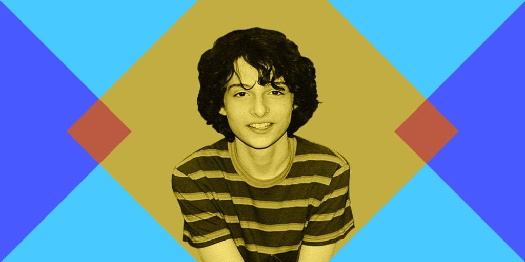 Graphic wallpaper of young Finn Wolfhard sepia portrait with bold blue and gold geometric background