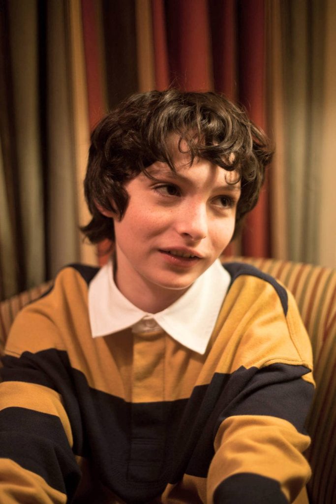 Finn Wolfhard as Mike Wheeler Stranger Things wallpaper curly hair navy mustard rugby shirt