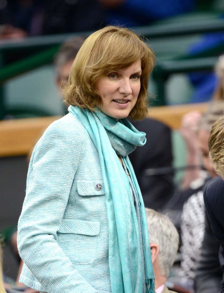 Fiona Bruce in turquoise blazer and scarf at stadium professional portrait wallpaper background