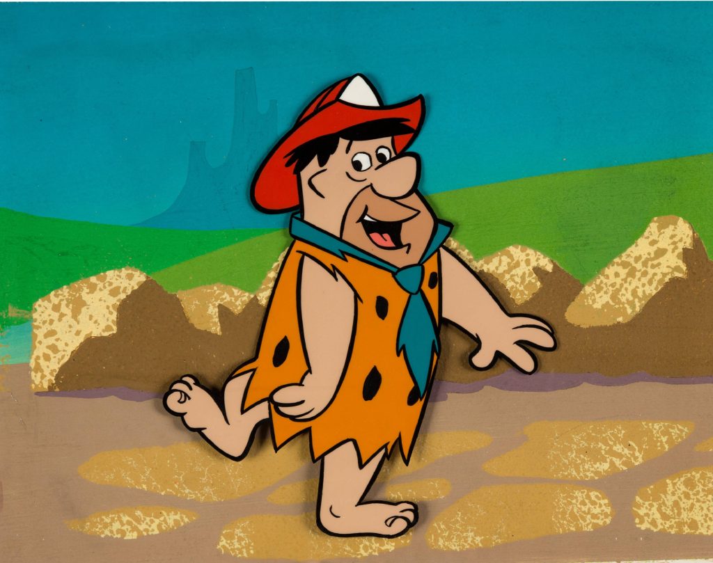 Fireman Fred Flintstone in orange leopard tunic and red helmet on Bedrock wallpaper background